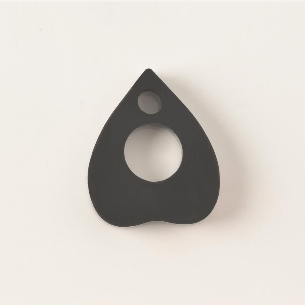 Black ouija planchet-shaped pet mini charm add on. on solid white background