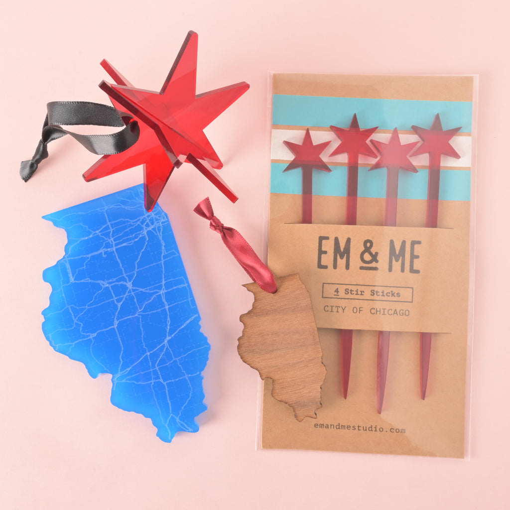 Chicago holiday gift set featuring red star ornament, blue Illinois ornament, wood Illinois ornament, and City of Chicago star stir sticks.