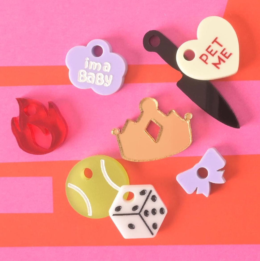 Assorted acrylic pet charms including crown, dice, tennis ball, bow, flame, heart, and fun quotes, perfect for pet collars and tags.