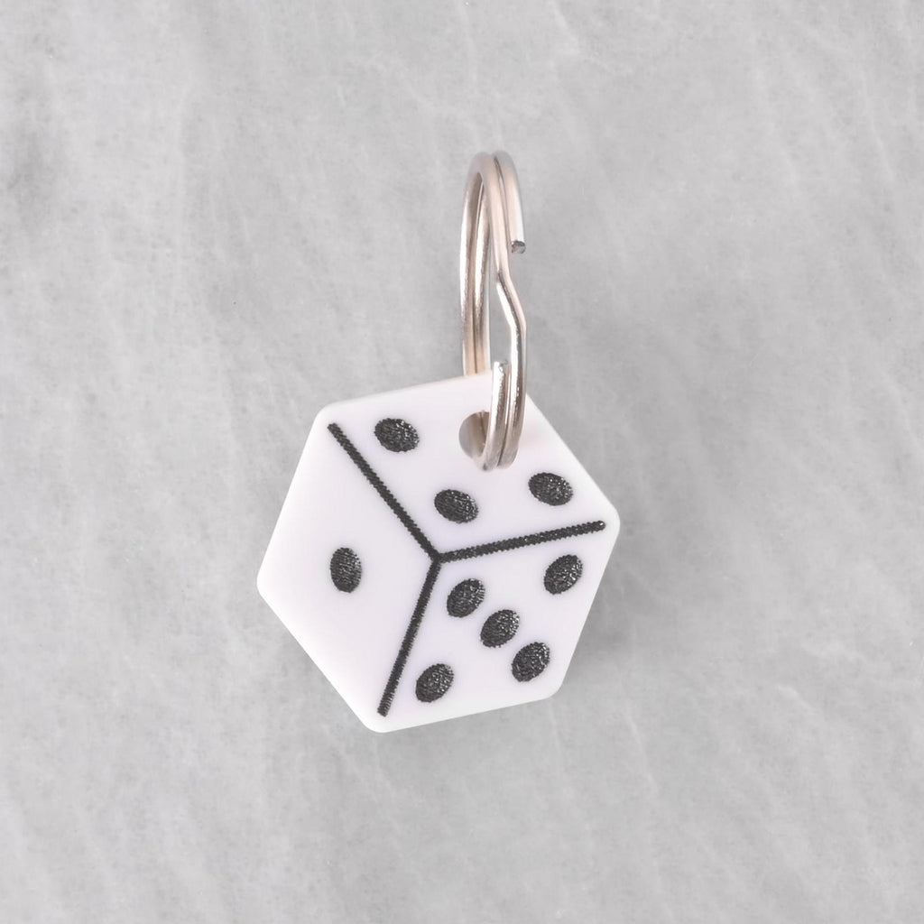 White dice-shaped pet ID tag with black dots, customizable name and phone number engraving, lucky charm design for dogs and cats.