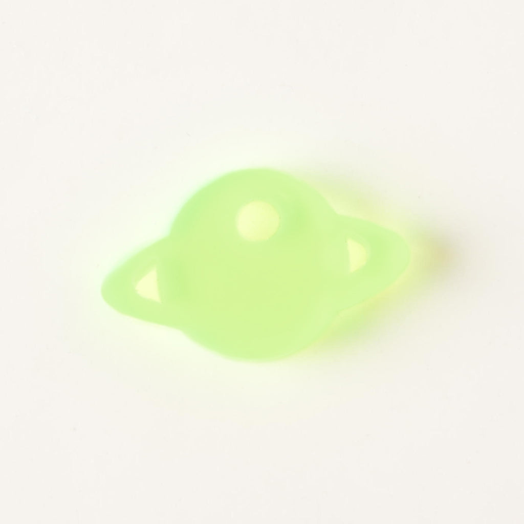 Fluorescent green Saturn-shaped mini charm add on for pet tags on solid white background