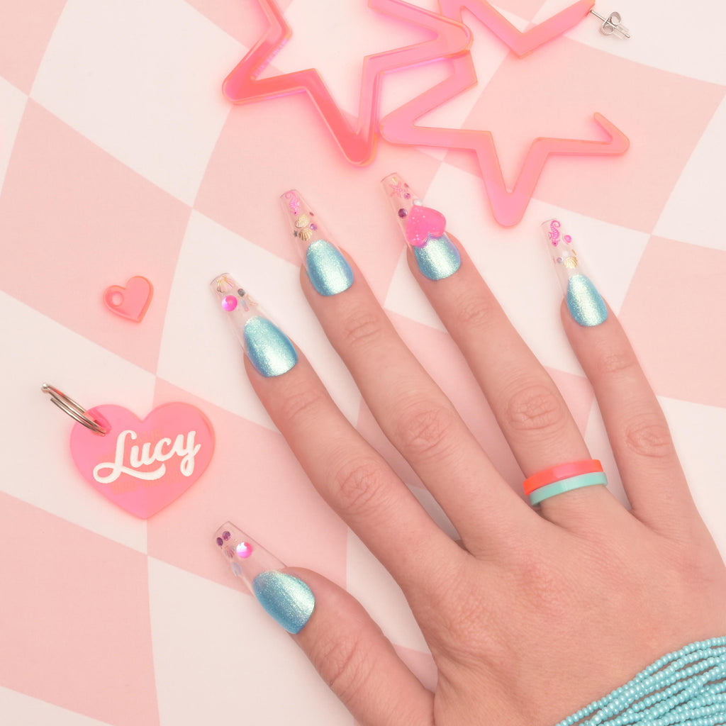 Fluorescent pink heart-shaped pet tag with blue Barbie inspired nails and fluorescent pink star-shaped hoop earringss