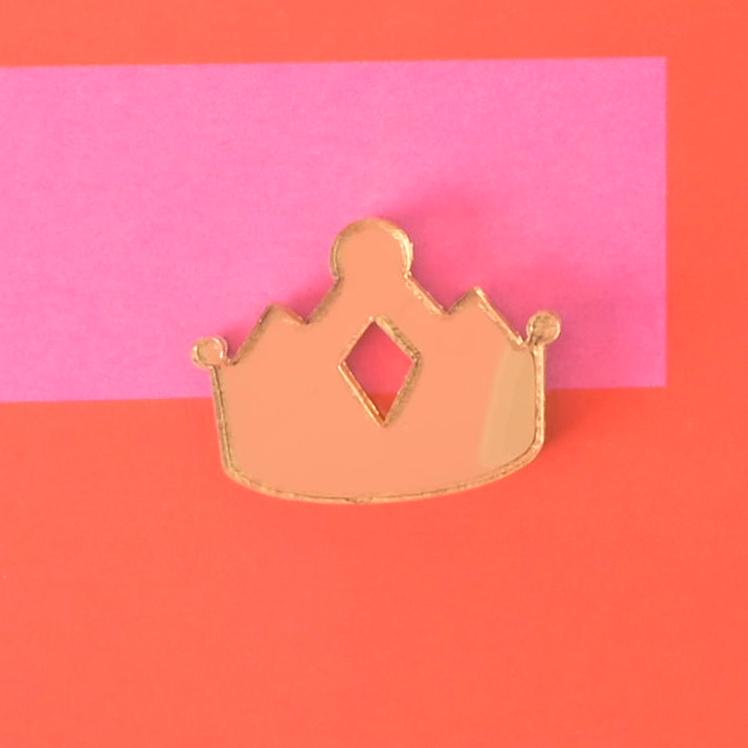 Gold acrylic crown-shaped pet charm with diamond cut-out detail, a royal-inspired accessory designed for stylish pet collars and tags.
