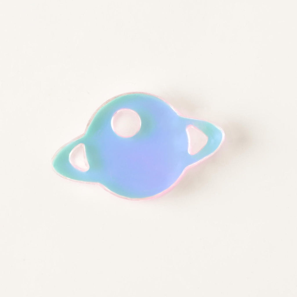 iridescent Saturn-shaped mini charm add on for pet tags on solid white background