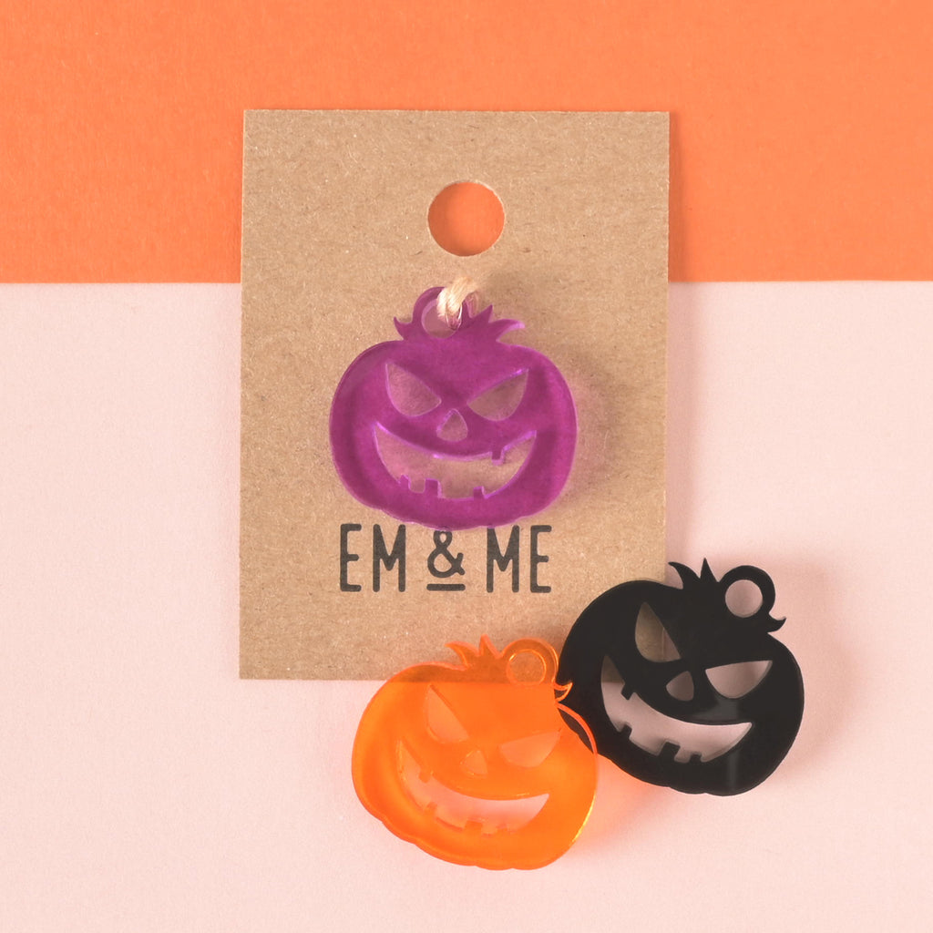 purple jack-o-lantern seasonal mini add on charm packaged on brown kraft paper card with orange and black jack-o-lanterns off to the side
