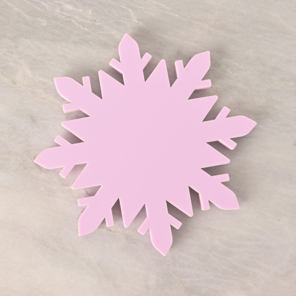 Pastel pink acrylic snowflake-shaped coaster, festive winter drink holder and holiday table decor, perfect for Christmas parties and gifts. Lavender