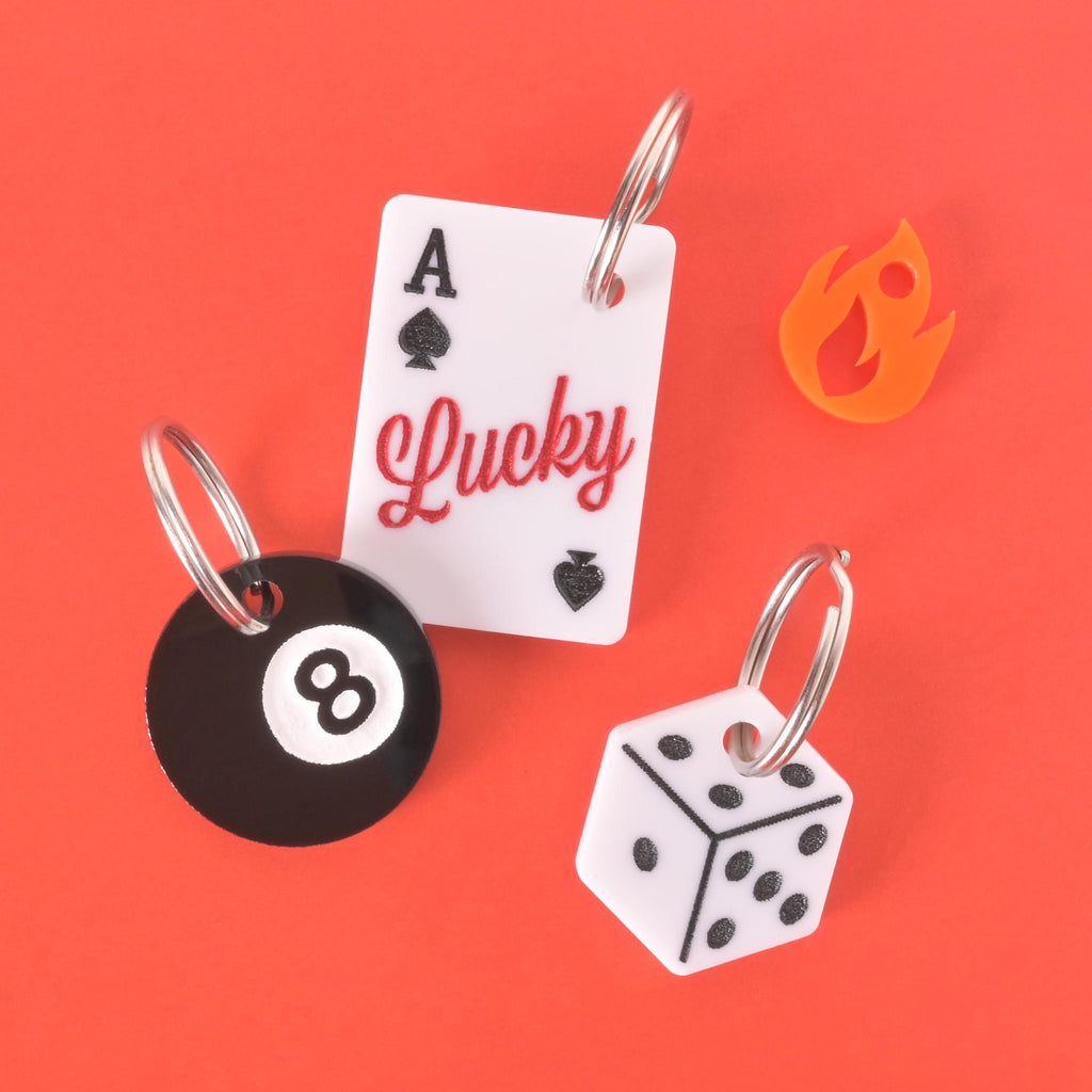Set of lucky-themed pet ID tags including Ace of Spades, 8 Ball, and Dice designs with custom engraving, fun name tags for dogs and cats.