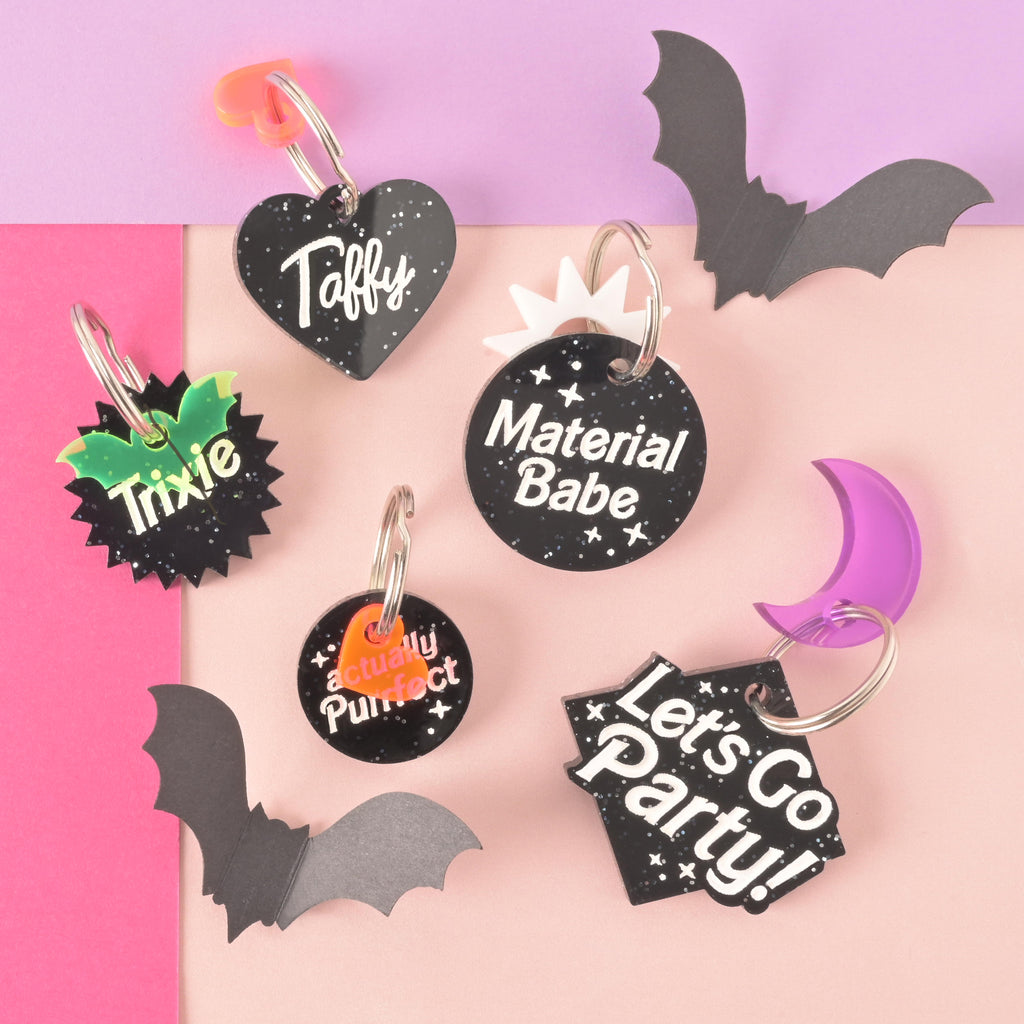 Collection of Barbie themed tags styled for halloween with black paper bats and color mini charms. Taffy Heart, Trixie Sunburst, material babe, lets go party, actually purrfect.