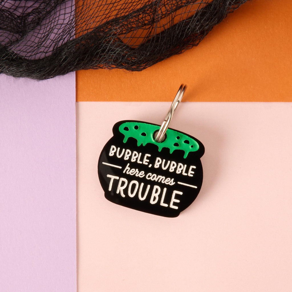 Bubble Bubble Here Comes Trouble pet tag showing front witches cauldron engraving