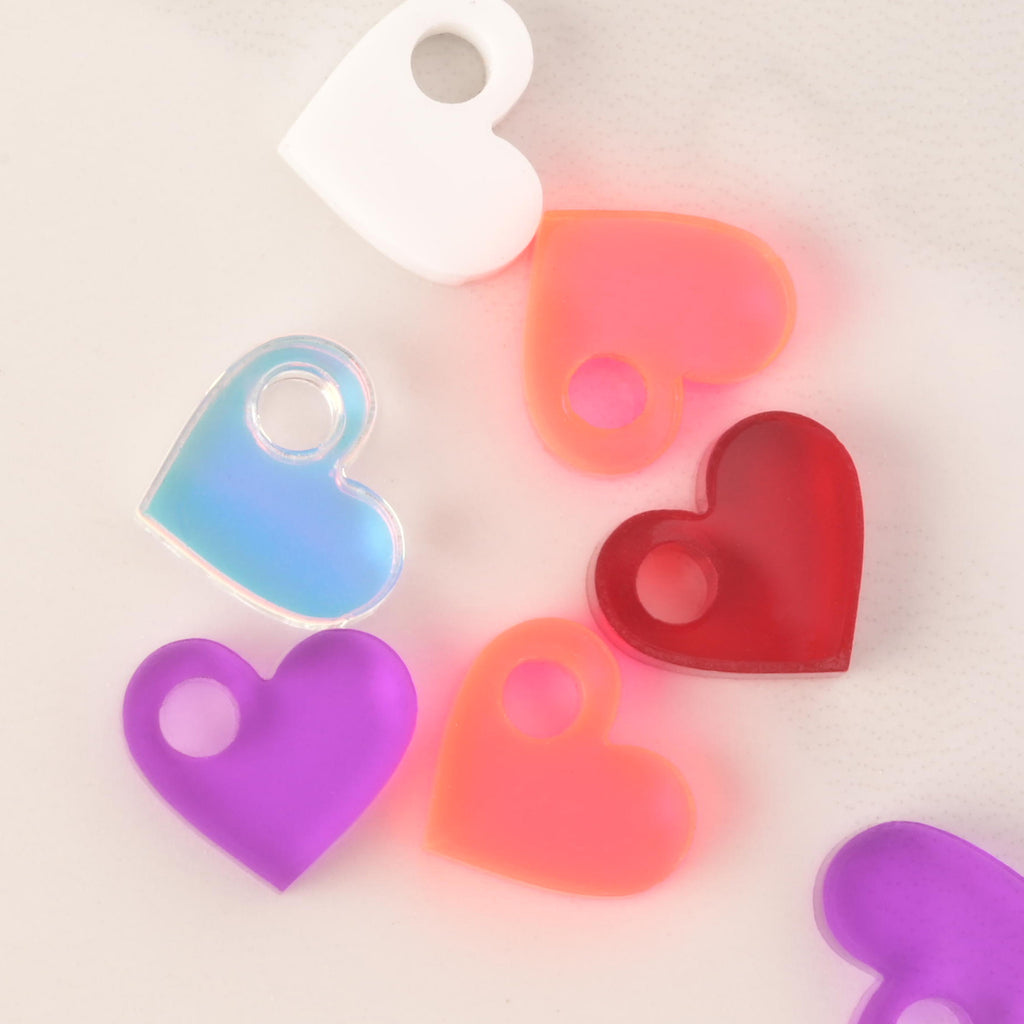 close up on a selection of tiny heart mini charms 