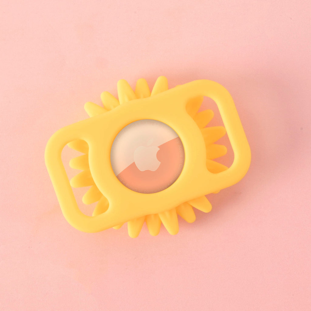 Flower shaped Silicone Airtag holder back on solid pink background