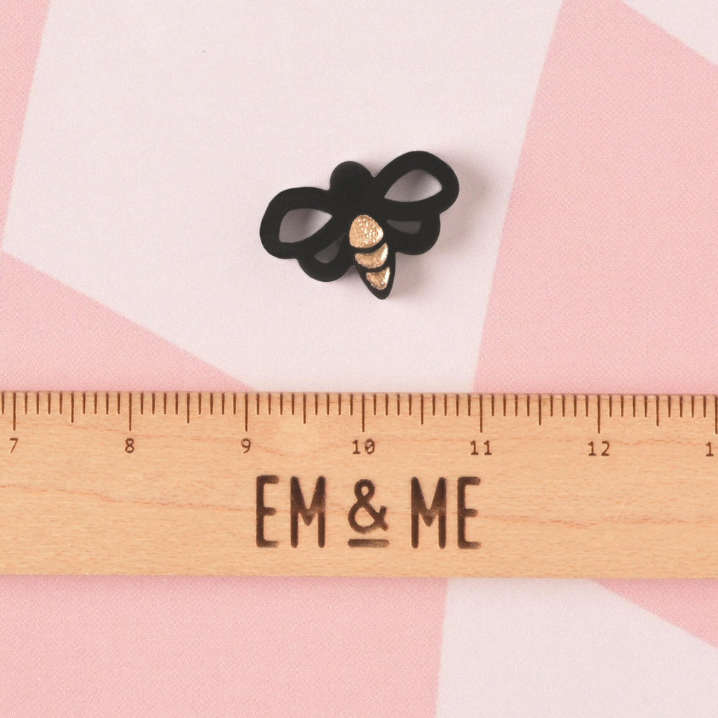 Bee-shaped Seasonal Mini, Tiny Honey Bee Accessory for Pet ID Tag, Cats and Dogs Add-on Charm with wooden ruler that reads "EM & ME" on pink background