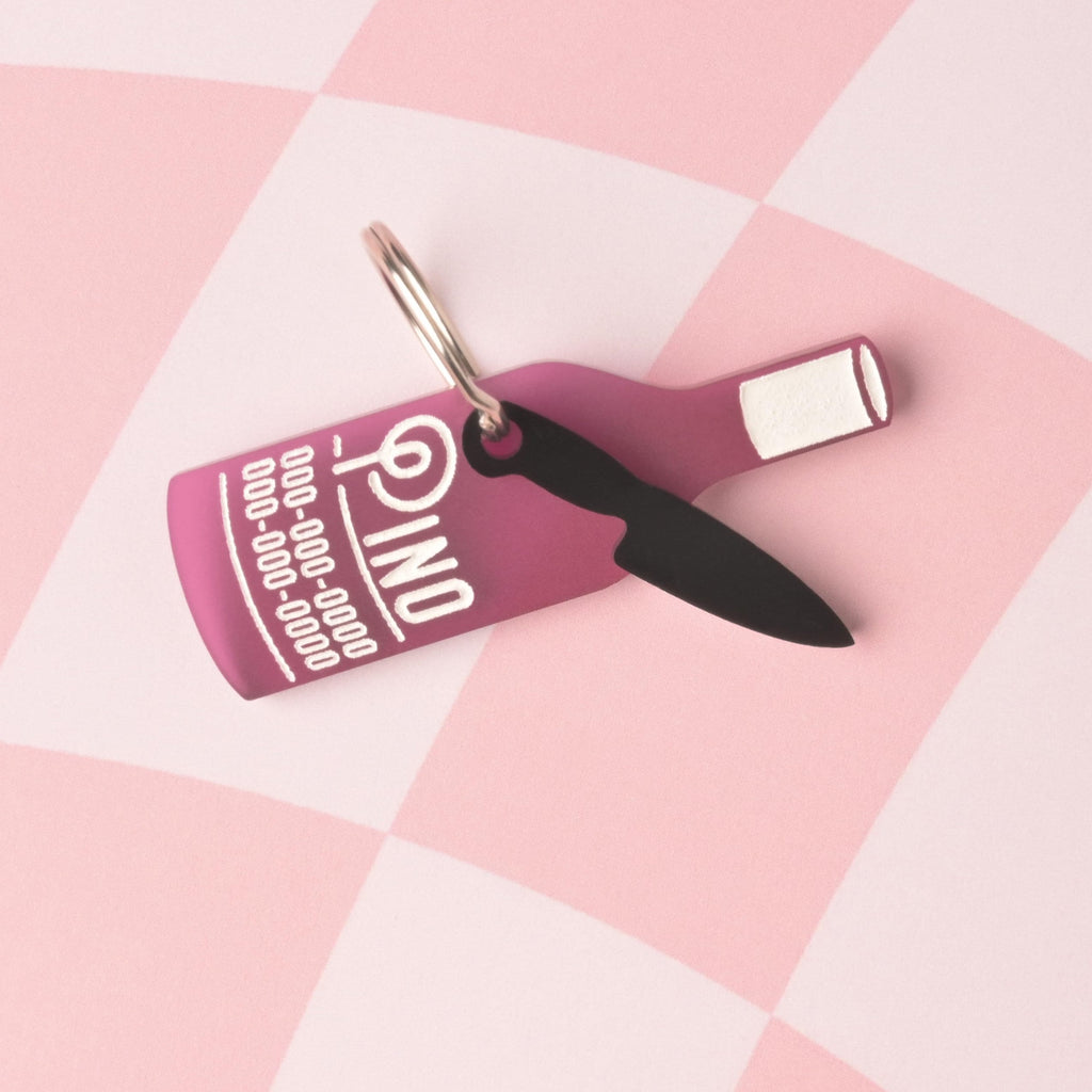 fake knife, Seasonal Mini,  Tiny Accessory for Pet ID Tag, Cats and Dogs Add-on Charm A small, opaque black acrylic mini charm shaped like a fixed-blade knife, hanging from a personalized wine bottle-shaped pet ID tag.