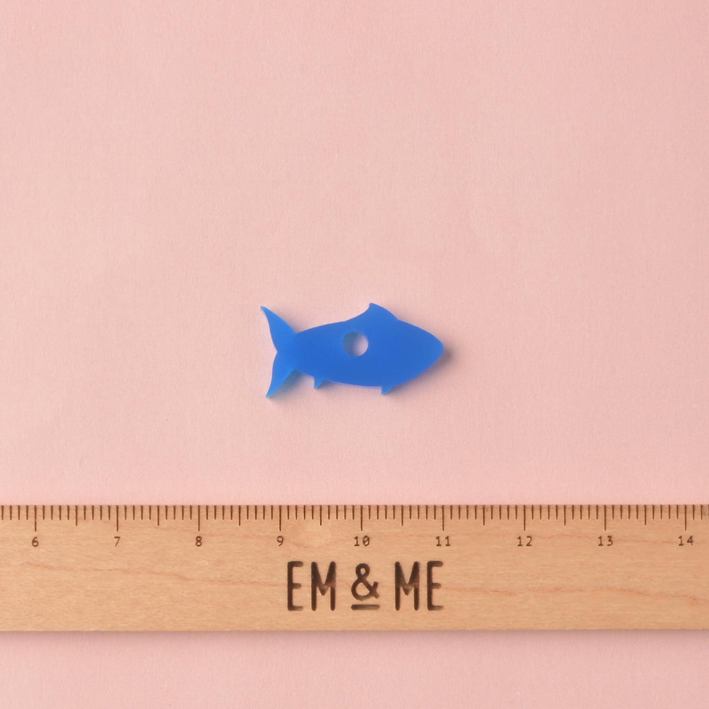 Blue Fish seasonal mini pet charm with wooden ruler that reads "EM & ME" on a solid pink background