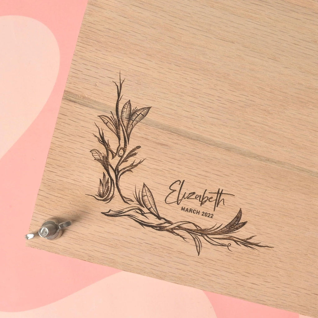 Close-up of oak flower press kit with custom engraving of floral design and personalized name Elizabeth March 2022