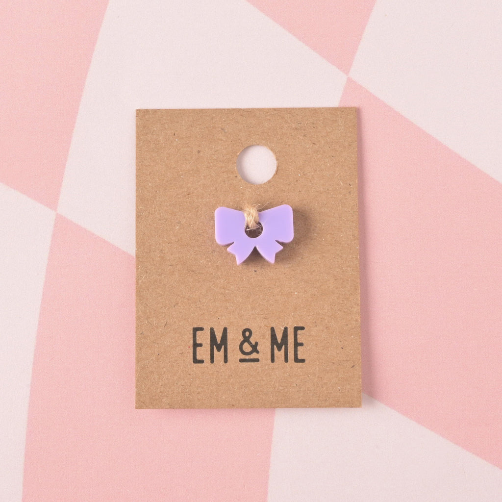 lavender Bow, Seasonal Mini, Tiny bow Accessory for Pet ID Tag, Cats and Dogs Add-on Charm packaged on brown kraft paper