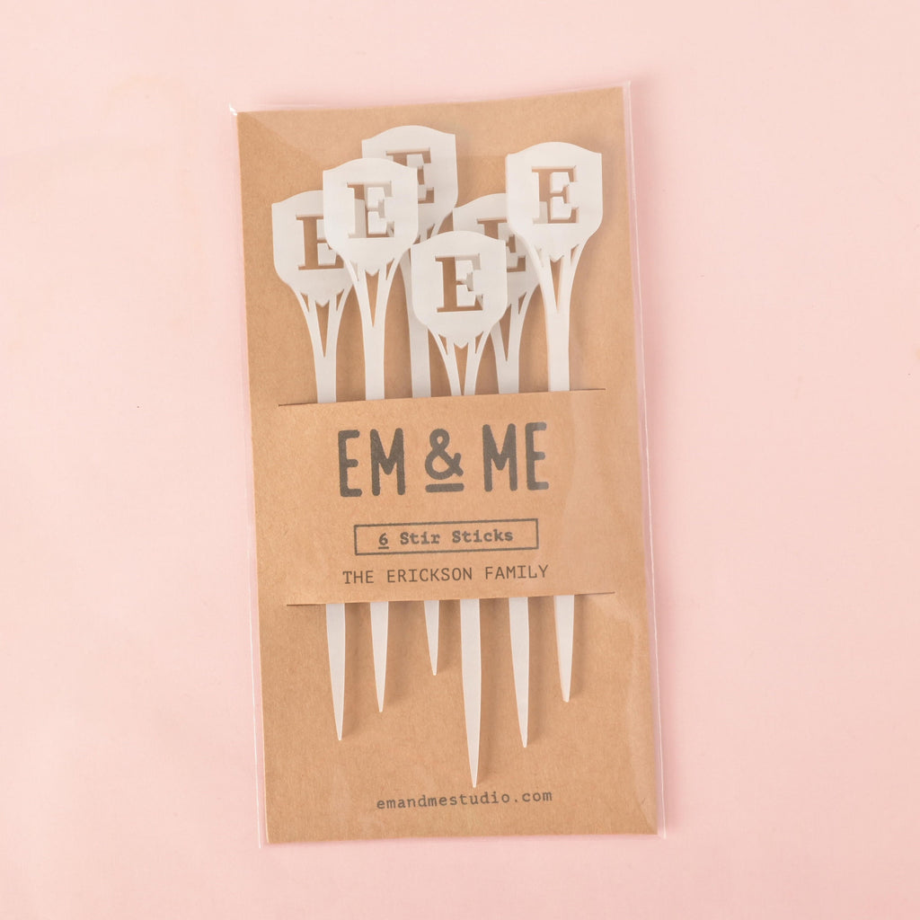 EM & ME packaged set of 6 white acrylic monogram stir sticks. Personalized with the initial 'E' for The Erickson Family. Custom party drink accessories. Personalized Family Shield Stir Sticks, Family Letter Initial Swizzle Sticks, Thanksgiving Bar cart, Stocking Stuffer